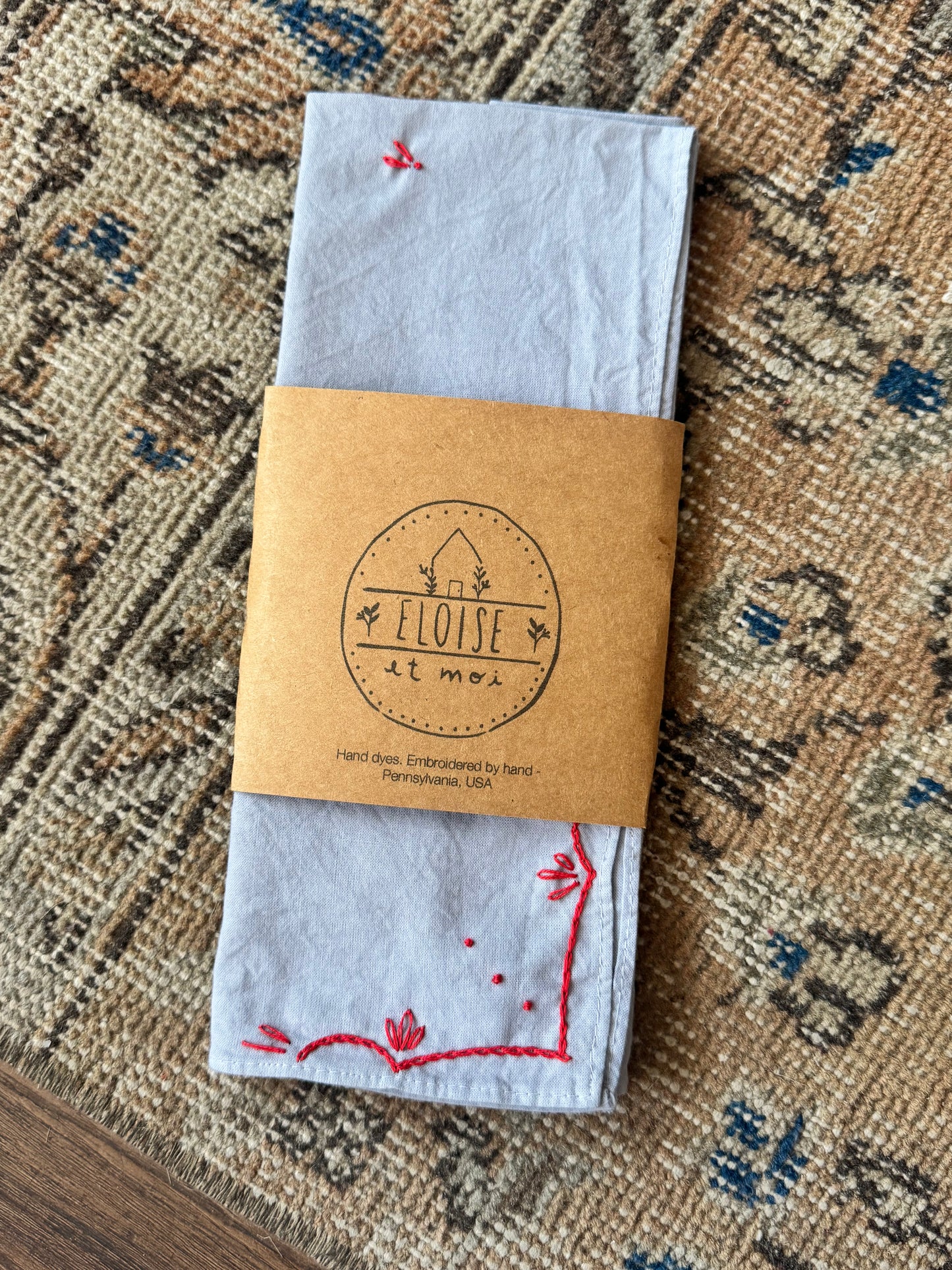 Hand-dyed embroidered rodeo cotton bandana in dust blue/red thread