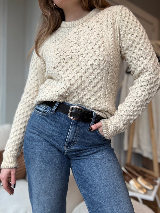 Vintage cozy winter sweater for women from local Chicago vintage boutique Petals and Jackets styled with vintage jeans and belt for a chic winter look.