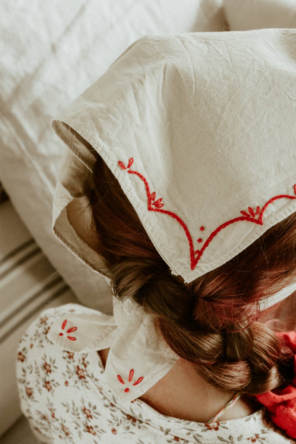 Hand-dyed embroidered rodeo cotton bandana in sandy white/red thread