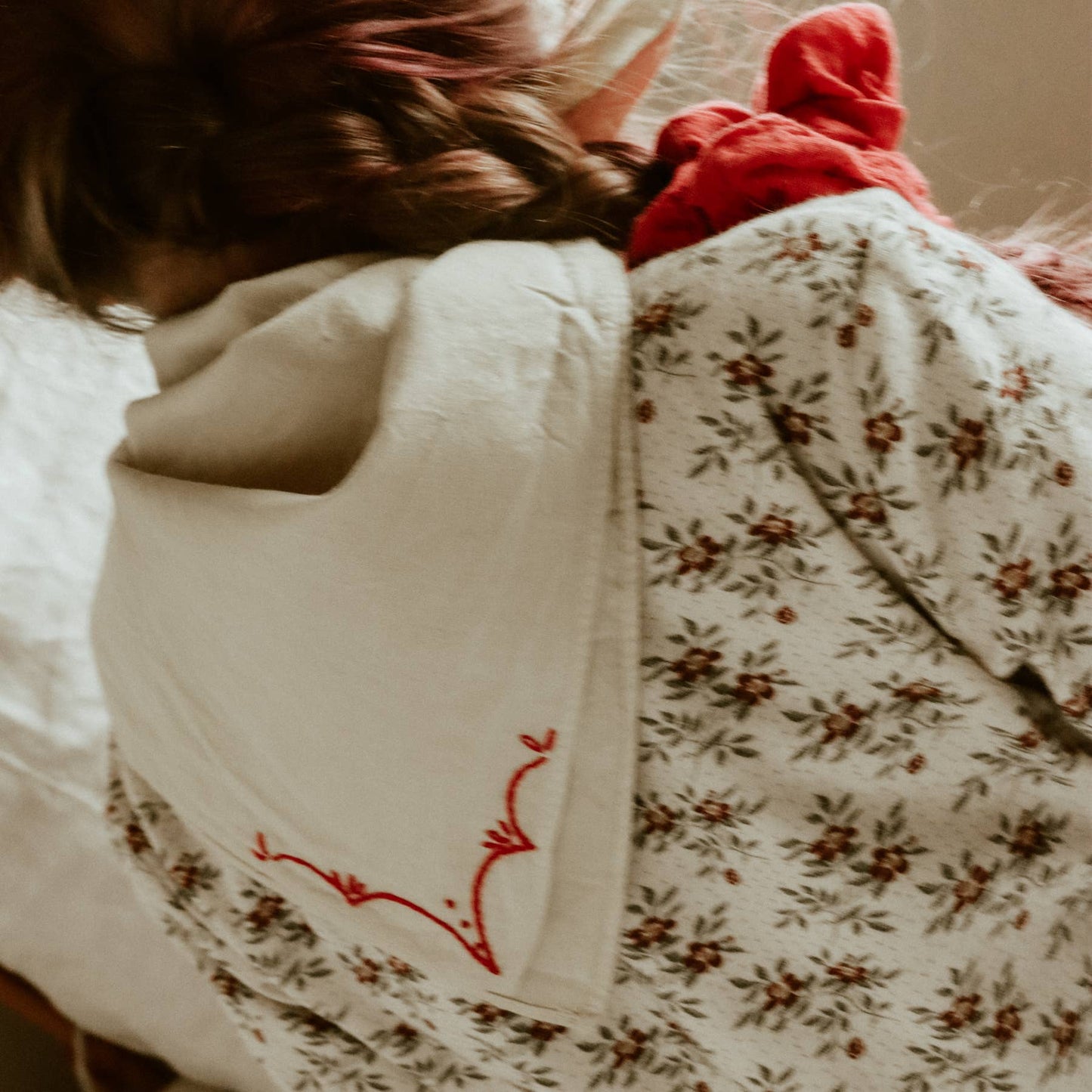 Hand-dyed embroidered rodeo cotton bandana in sandy white/red thread