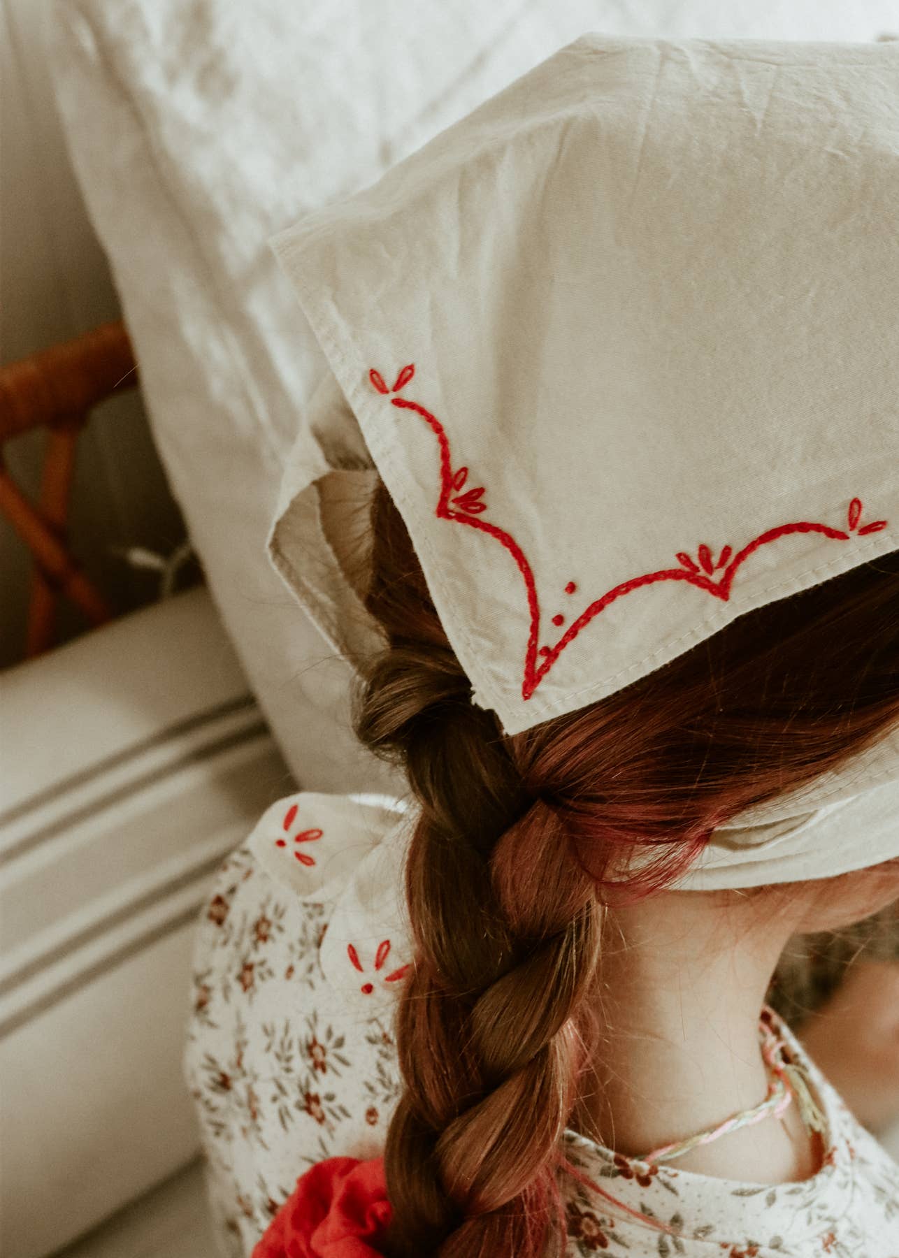 Hand-dyed embroidered rodeo cotton bandana in sandy white/red thread