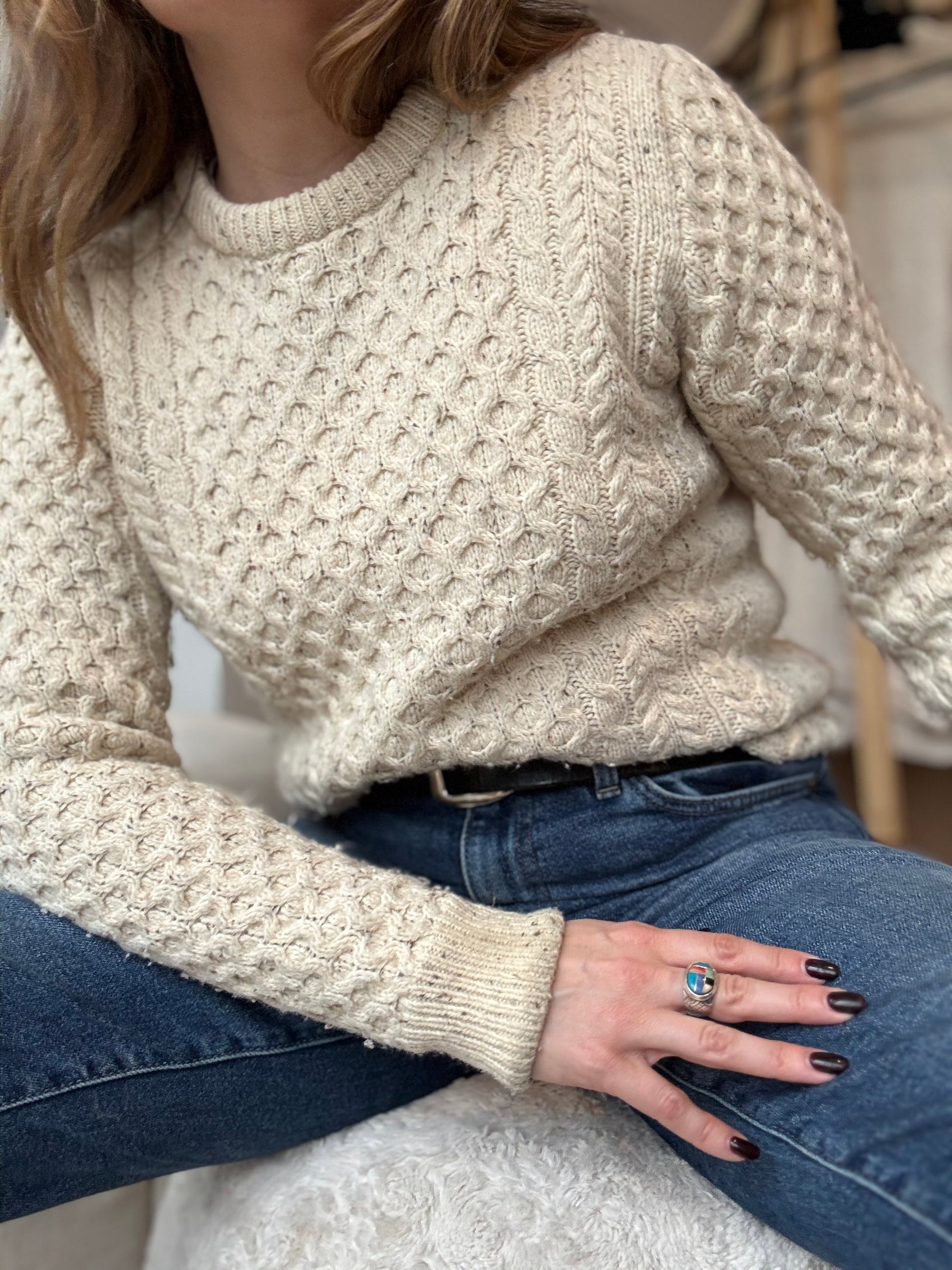Chicago Vintage boutique owner wears a vintage virgin wool by Lord Jeff styled with dark jeans and a black belt for a chic vintage winter look. 
