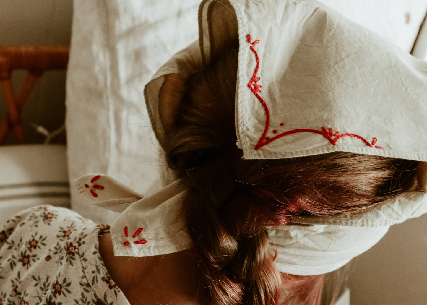 Hand-dyed embroidered rodeo cotton bandana in sandy white/red thread