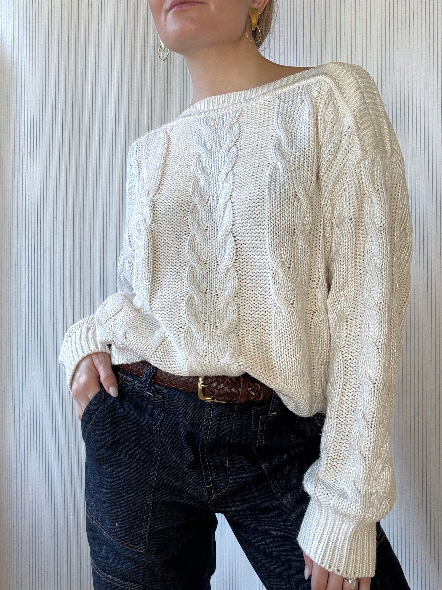 West Town Chicago vintage owner wears a white cable knit sweater with jeans for a classic, chic, casual holiday look. 